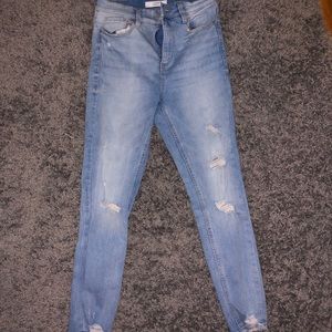 high-waisted light denim ripped skinny jeans